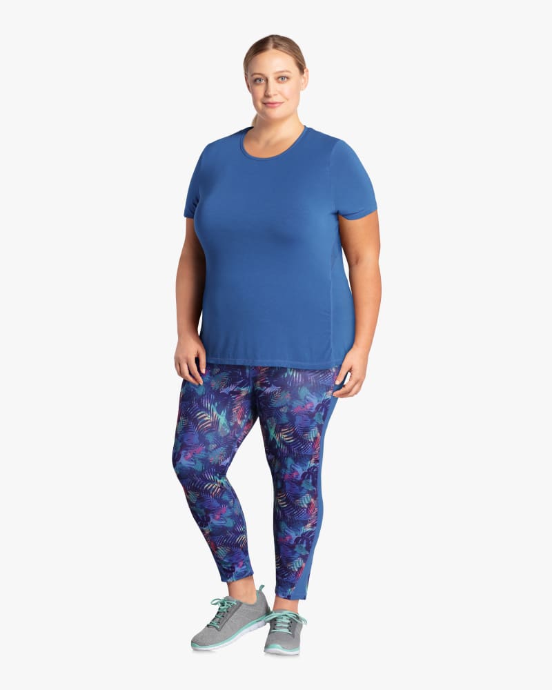 Plus size model with hourglass body shape wearing Dash Mesh Racerback Performance Tee  by Solspry | Dia&Co | dia_product_style_image_id:114680